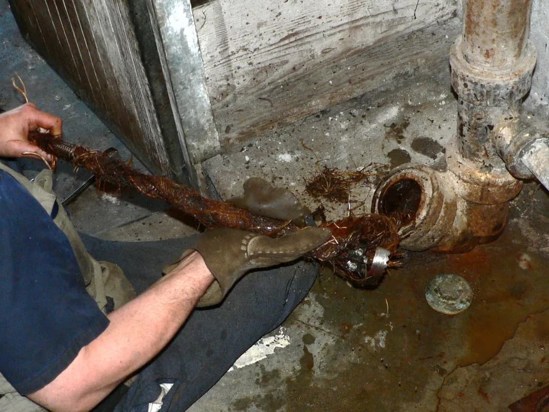 Drain cleaning equipment at work on a clogged line
