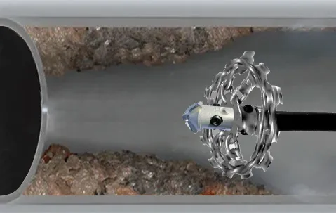 Mechanical pipe descaling equipment removing scale from a sewer line