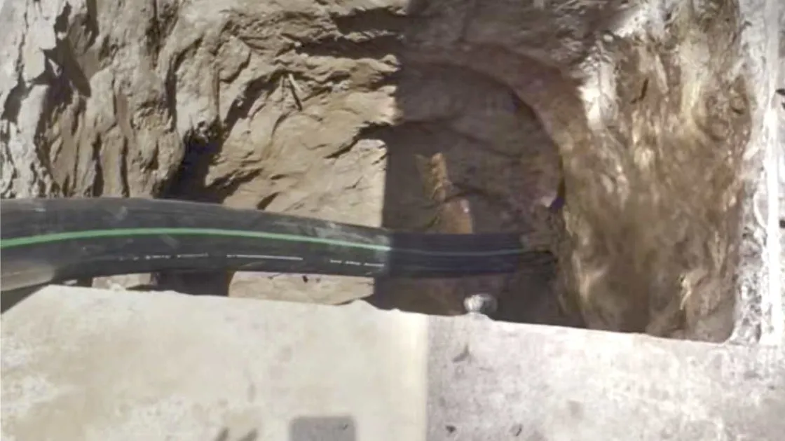 Pipe bursting equipment replacing a sewer line without excavation